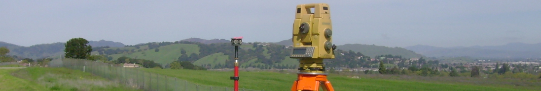 Total station surveying equipment in a field